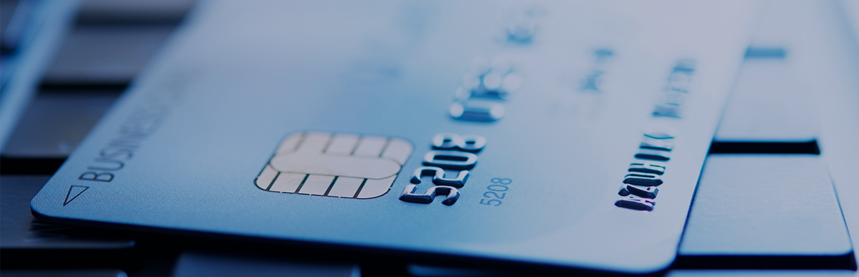 close up of credit or bank cards with a navy blue overlay