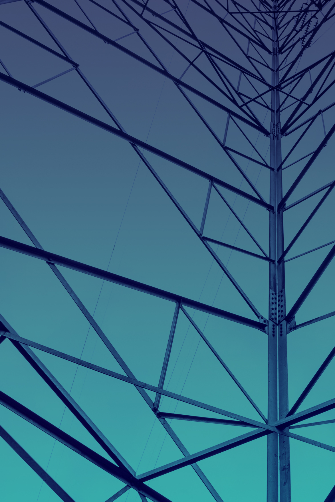 close up of a large powerline tower with a blue sky background