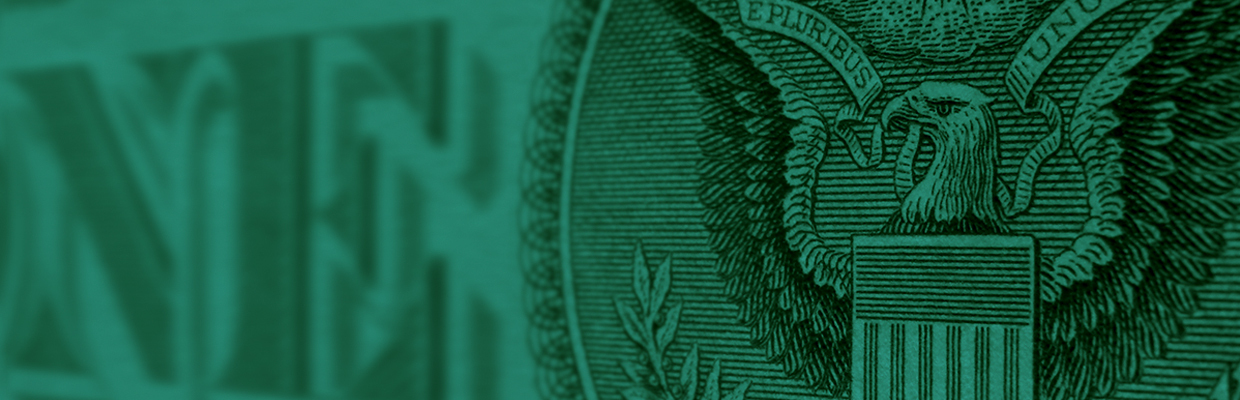 dark green background displaying a closeup of American paper money
