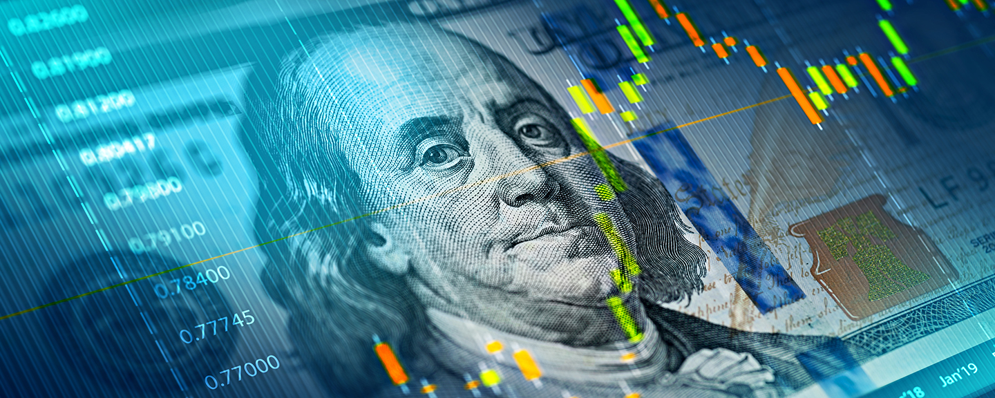 close up of American paper money with an overlay image of financial data charts in blue