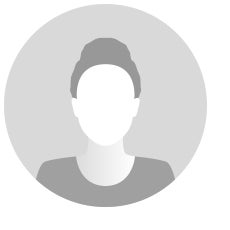 black and white icon image of nondescript person wearing a dark shirt with round collar hair pulled into a bun