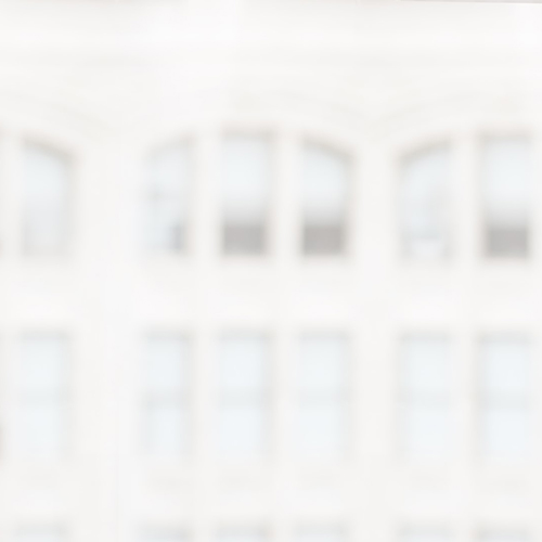 Image of white and light gray building with lots of windows