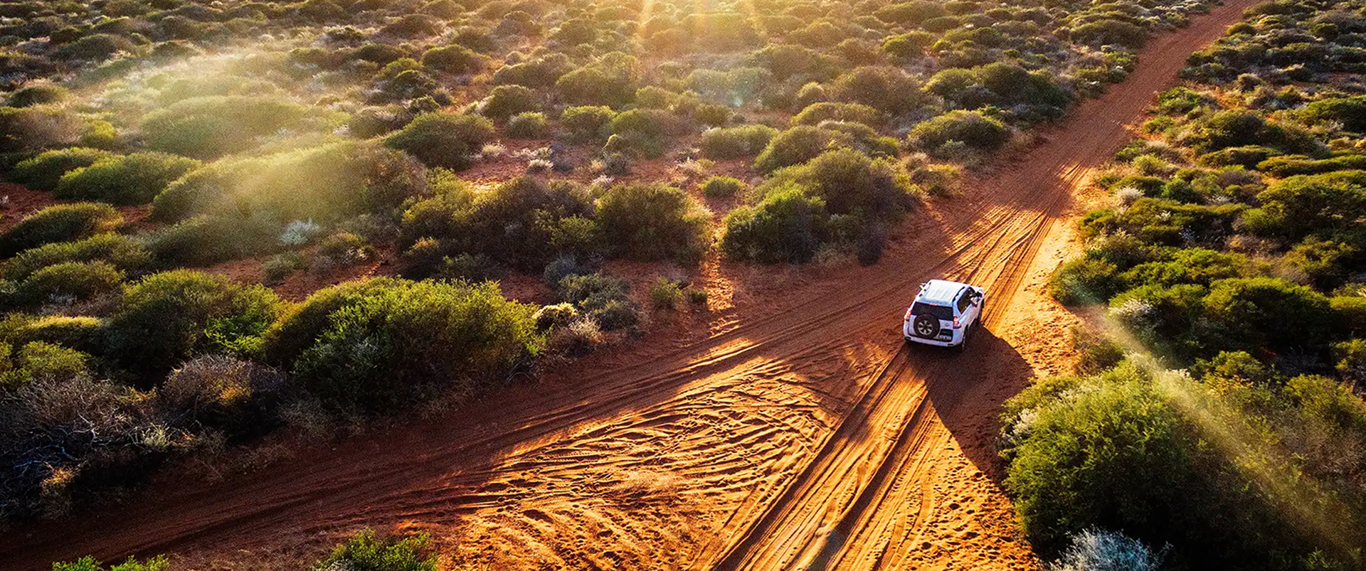 Car driving through desert