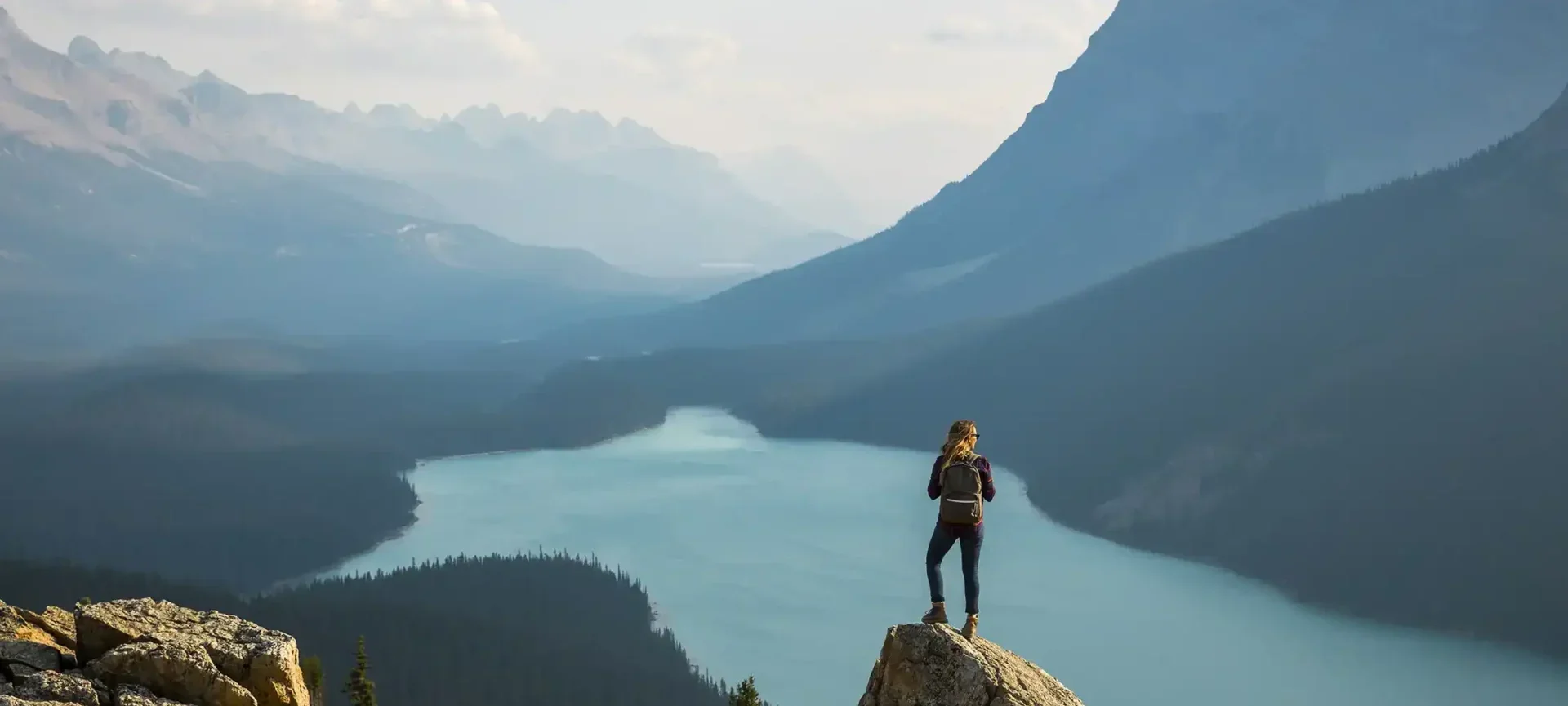 Women overlooking a Mountain range