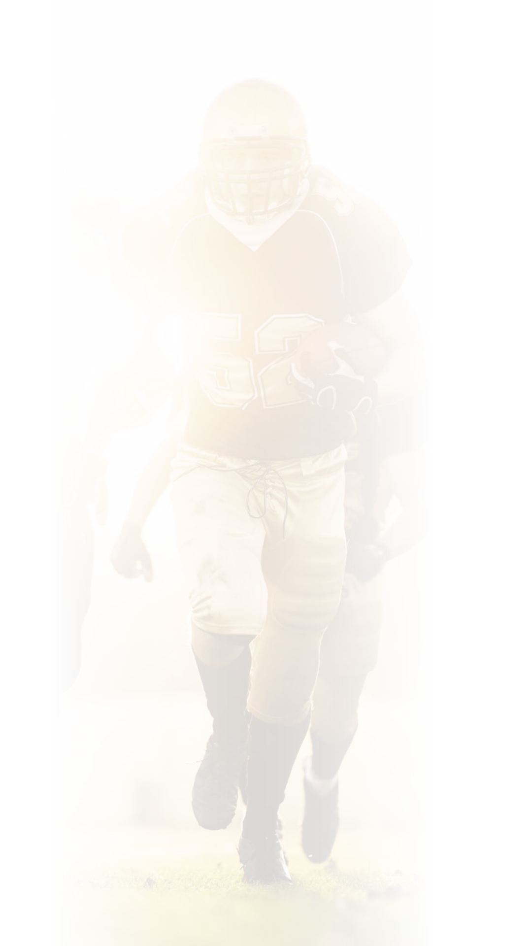 American football players in action on the playing field.