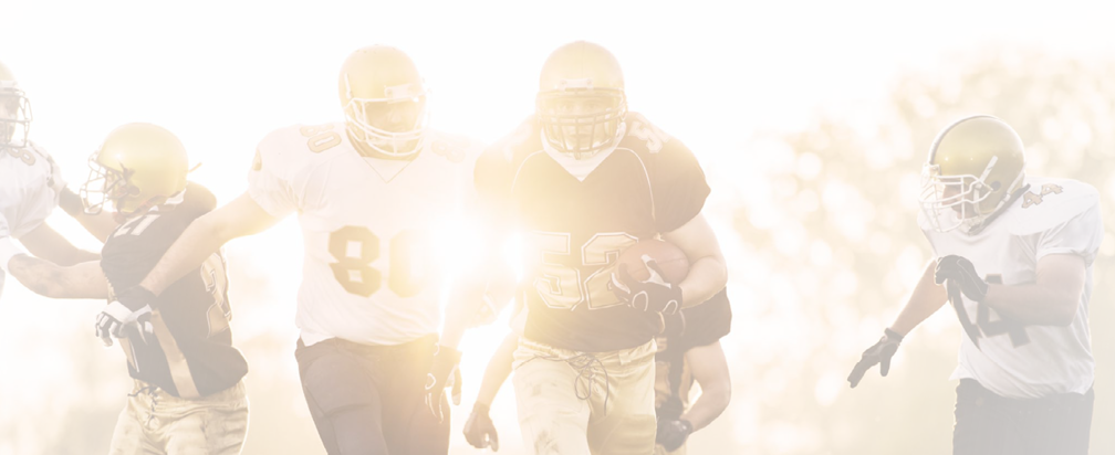 American football players in action on the playing field.