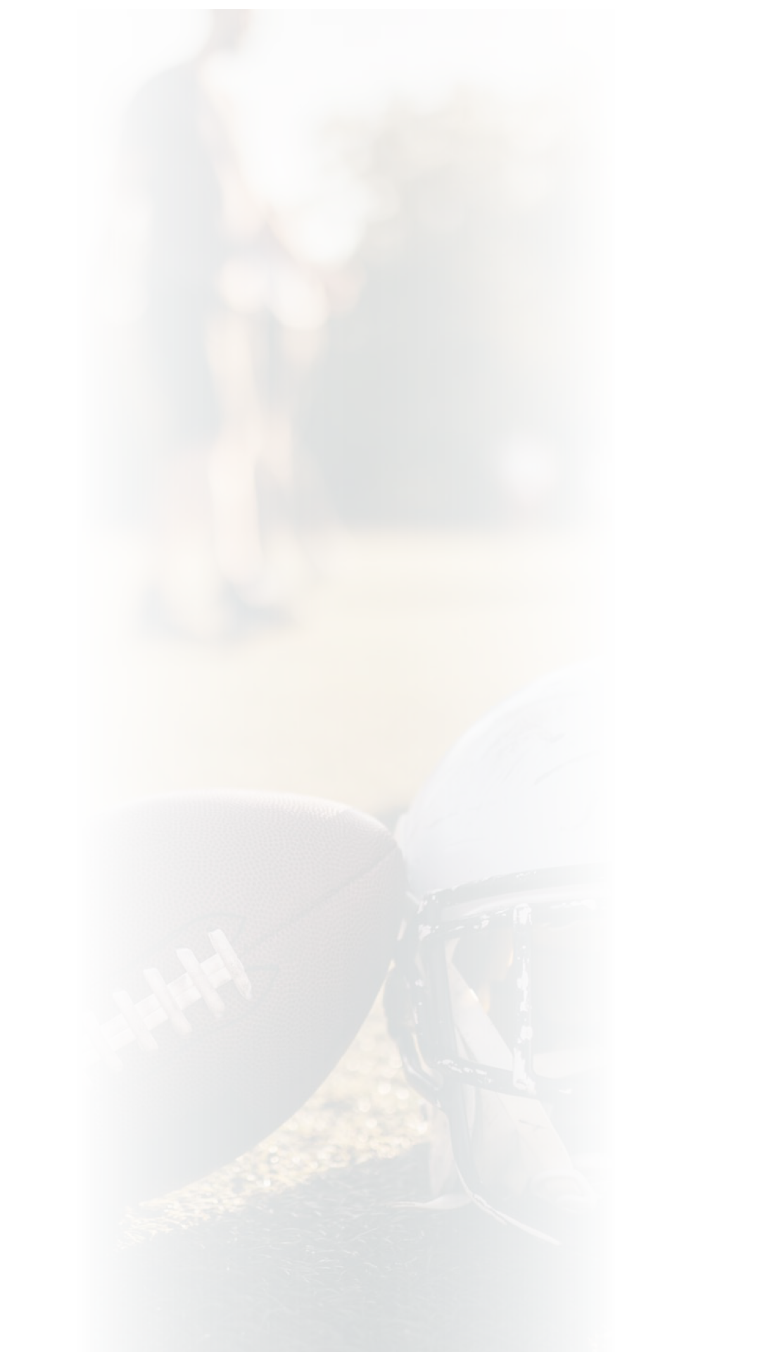 American football helmets and ball on the playing field.